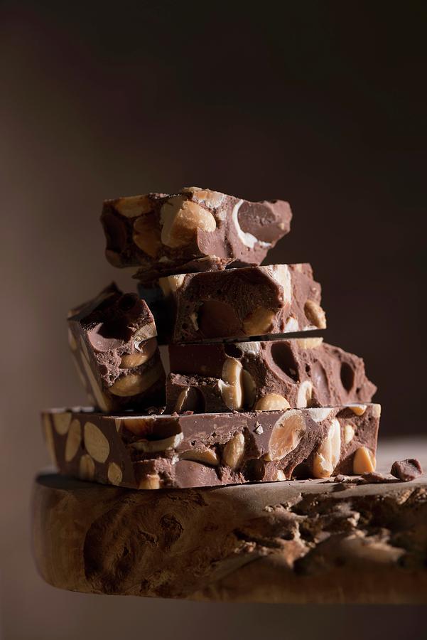 A Stack Of Chocolate Turron From Spain Photograph by Laurange