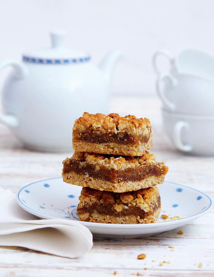 A Stack Of Date Crumble Slices Photograph by Udo Einenkel