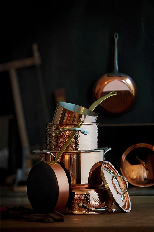 A Stack Of Different Copper Pots Photograph by Jalag / Michael Bernhardi