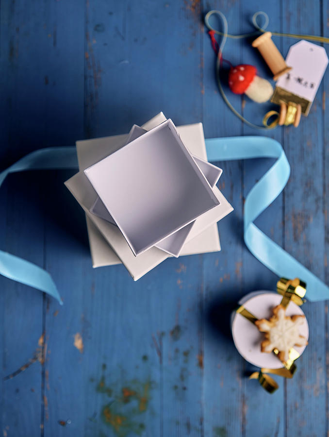 A Stack Of Empty Gift Boxes With Ribbons And Christmas Decorations Photograph by Angelika Grossmann