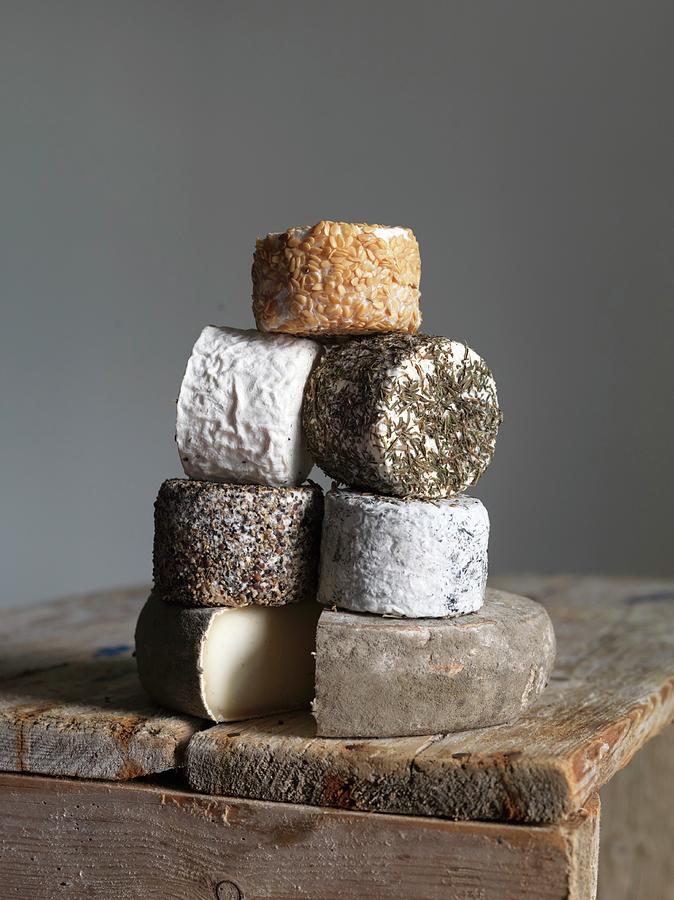 Cheese Photograph - A Stack Of Goats Cheese From Normandy by Joerg Lehmann