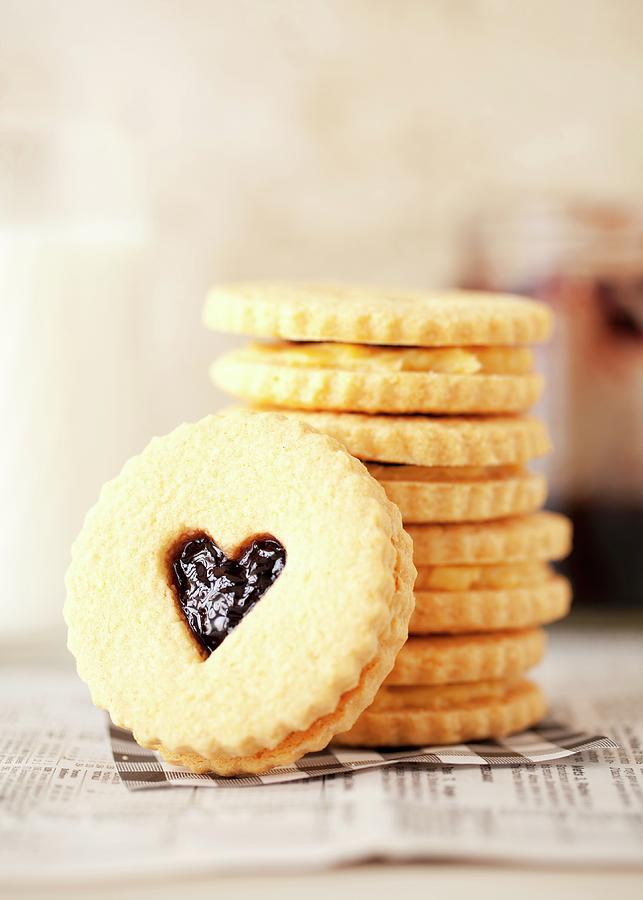 A Stack Of Jam And Cream Sandwich Biscuits With Heart-shaped Windows Photograph by Jane Saunders