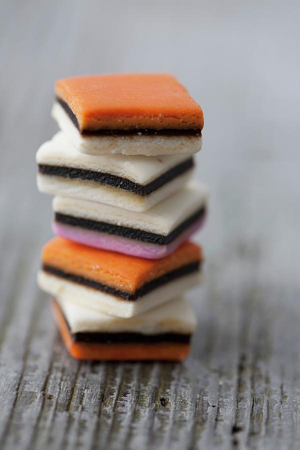 A Stack Of Liquorice Sweets Photograph by Martina Schindler