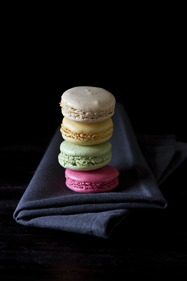 A Stack Of Macaroons In Four Different Colours Photograph by Catja Vedder