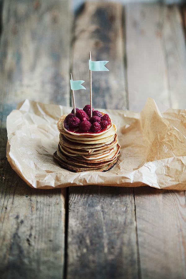 A Stack Of Mini Pancakes With Raspberries And Little Flags Photograph by Fanny Rdvik