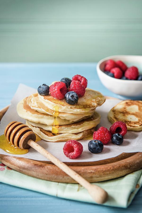 A Stack Of Pancakes With Berries And Honey Photograph by Magdalena Hendey