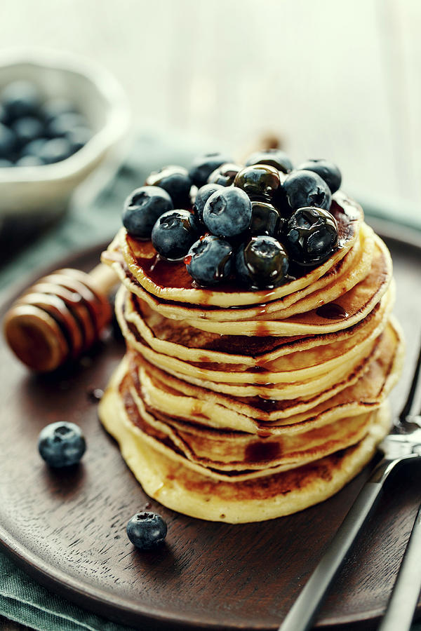 A Stack Of Pancakes With Blueberries And Maple Syrup Photograph by Valeria Aksakova