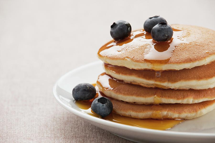 A Stack Of Pancakes With Fresh Blueberries And A Syrup Photograph by Richard Church