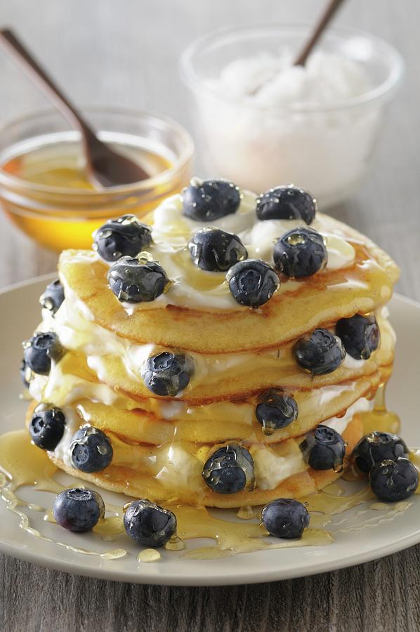 A Stack Of Pancakes With Ricotta, Syrup And Blueberries Photograph by Jean-christophe Riou