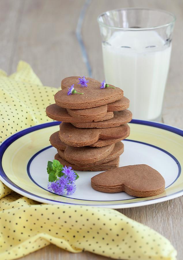 A Stack Of Peanut Butter And Chocolate Cookies Shaped Like Hearts And Stars With A Glass Of Milk Photograph by Yelena Strokin