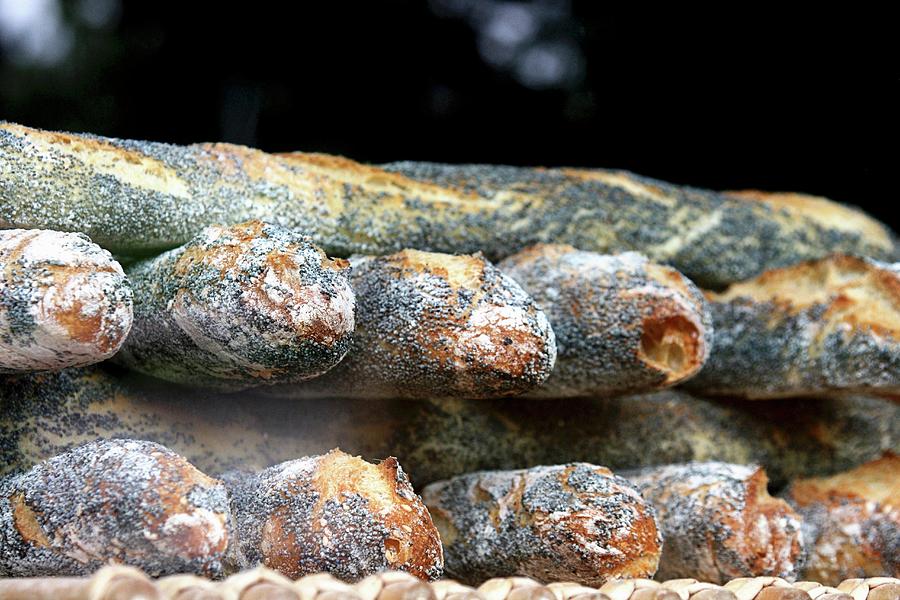 A Stack Of Poppy Seed Baguettes Photograph by Alexandra Panella