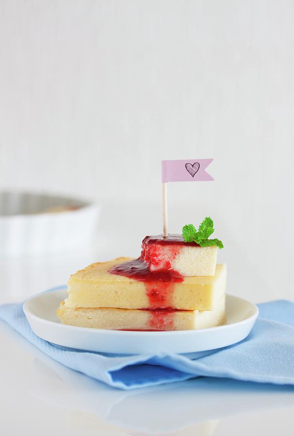 A Stack Of Quark And Semolina Slices With Raspberry Sauce And Mint Leaves Photograph by Valeria Aksakova