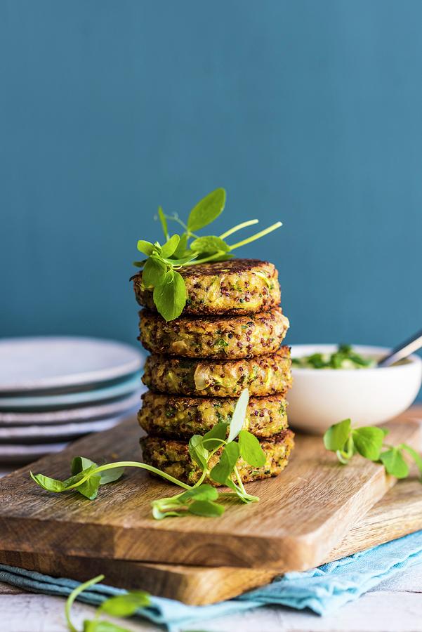 A Stack Of Quinoa Veggie Fritters On A Chopping Board Photograph by Hein Van Tonder