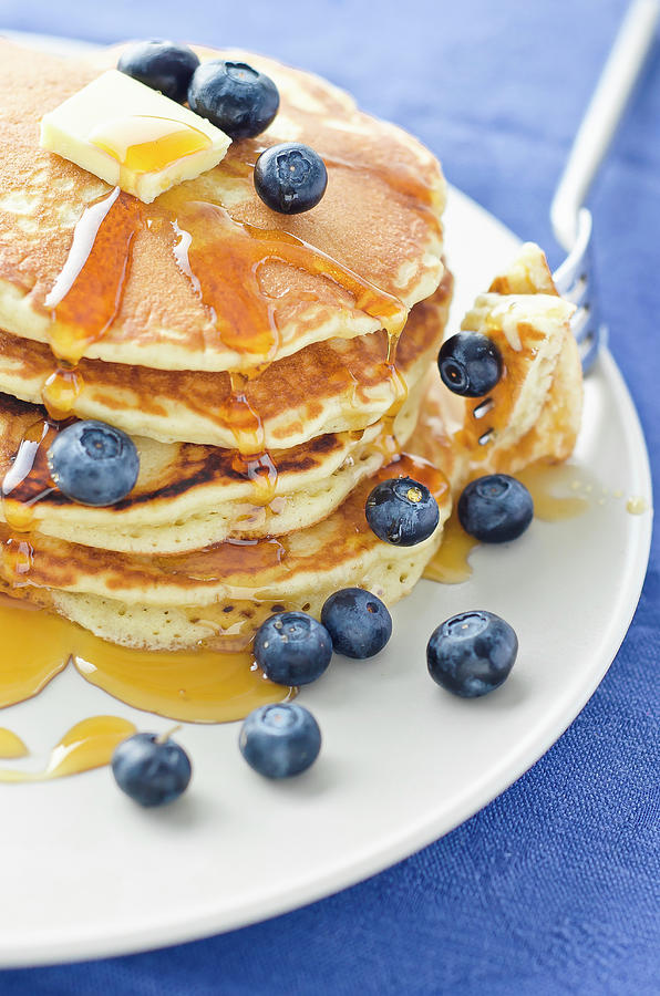 A Stack Of Three Blueberry Pancakes With Maple Syrup And Orange Juice Photograph by Giulia Verdinelli Photography