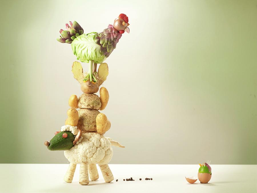 A Stack Of Vegetable Animals With An Easter Egg Photograph by Nikolai Buroh