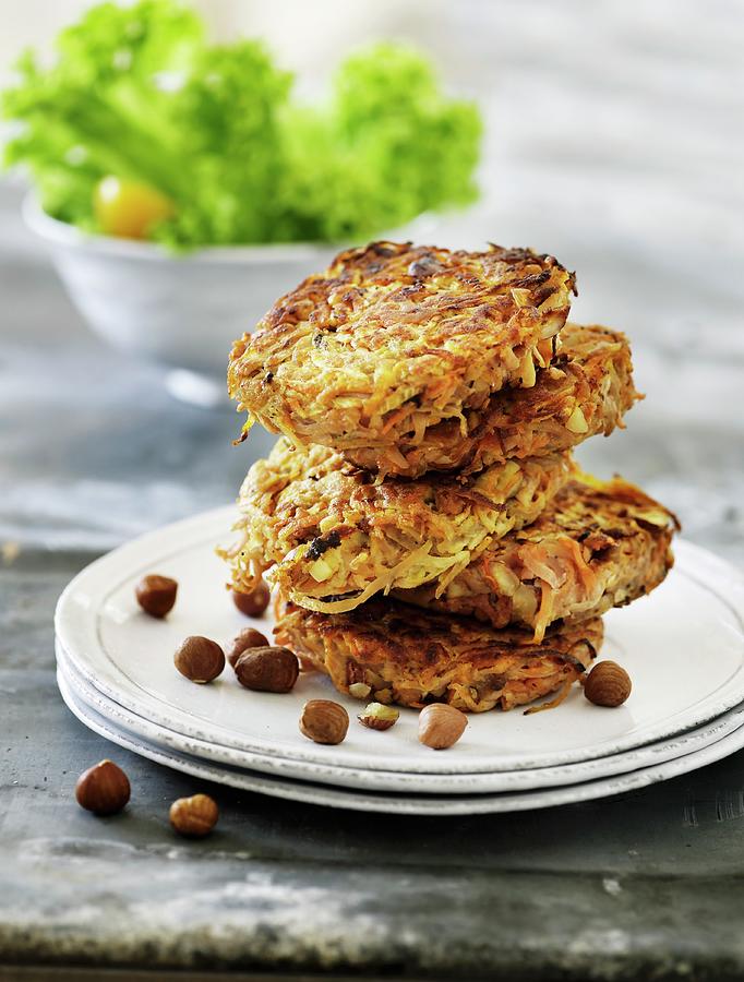 A Stack Of Vegetable Cakes With Hazelnuts Photograph by Mikkel Adsbl