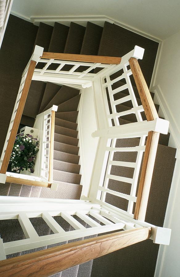 A Stairwell With A Spiral Staircase Photograph by Bertrand Limbour - Pixels