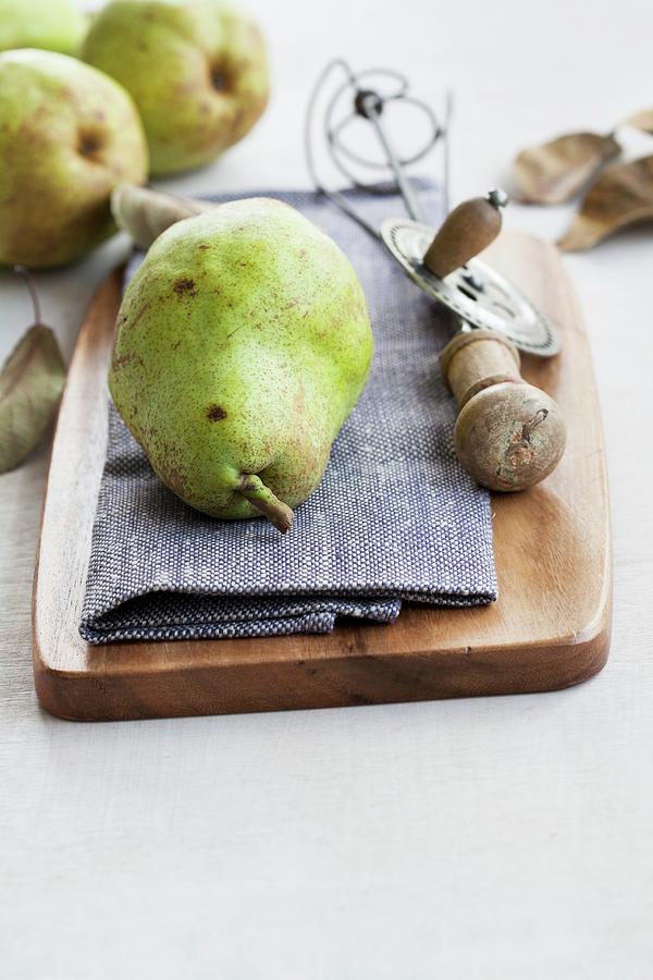 A Still Life Featuring A Williams Christ Pear And An Old-fashioned Whisk Photograph by Schindler, Martina