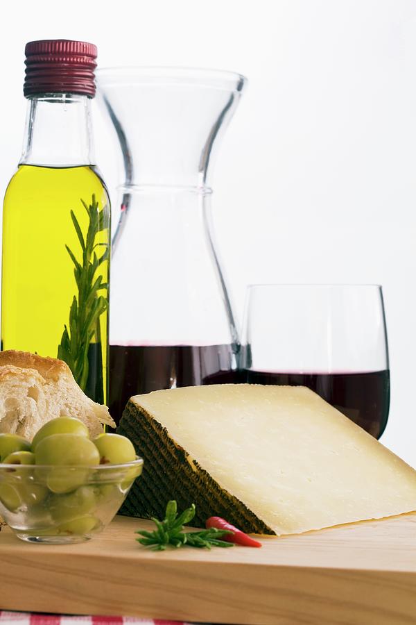 A Still Life Featuring Olive Oil, Red Wine, Bread, Olives And Manchego spain Photograph by Dudley Wood