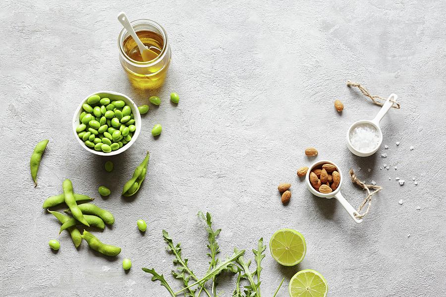A Still Life With Edamame, Almonds, Olive Oil, Salt, Limes And Arugula Photograph by Sabrina Sue Daniels