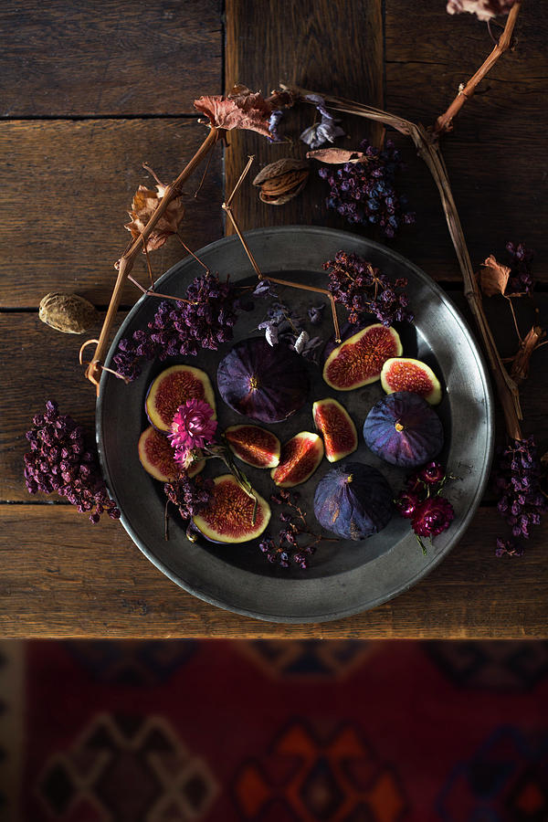 A Still Life With Fresh Figs, Dried Grapes And Grapevine Branches Photograph by Sabine Lscher
