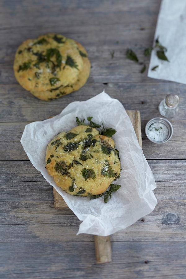 A Stinging Nettle Bread Roll On Greaseproof Paper Photograph by Anke Schtz