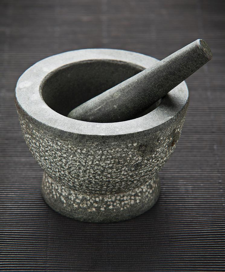 A Stone Mortar With A Pestle Photograph by Richard Church