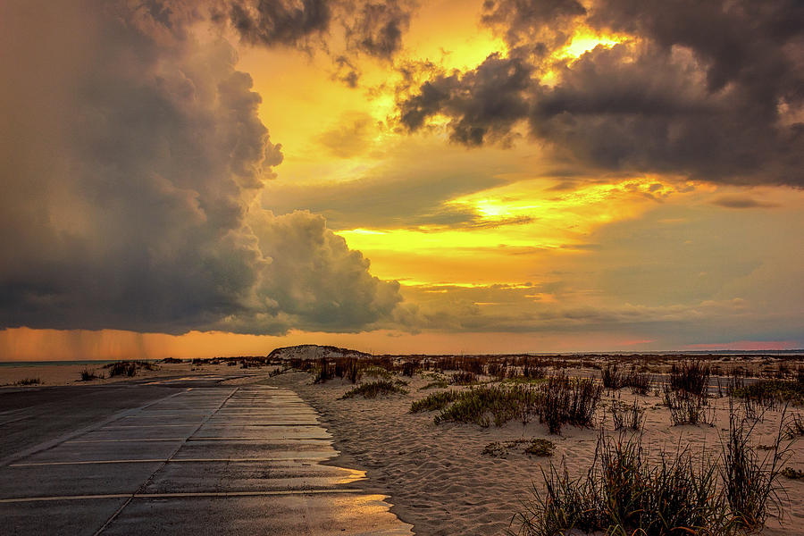 Sunset Photograph - A storm aglow by Mike Whalen