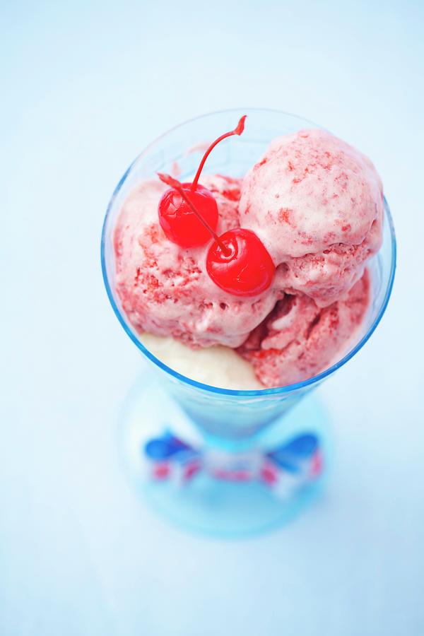 A Strawberry And Vanilla Ice Cream Sundae With Glac Cherries Photograph by Studio Lipov