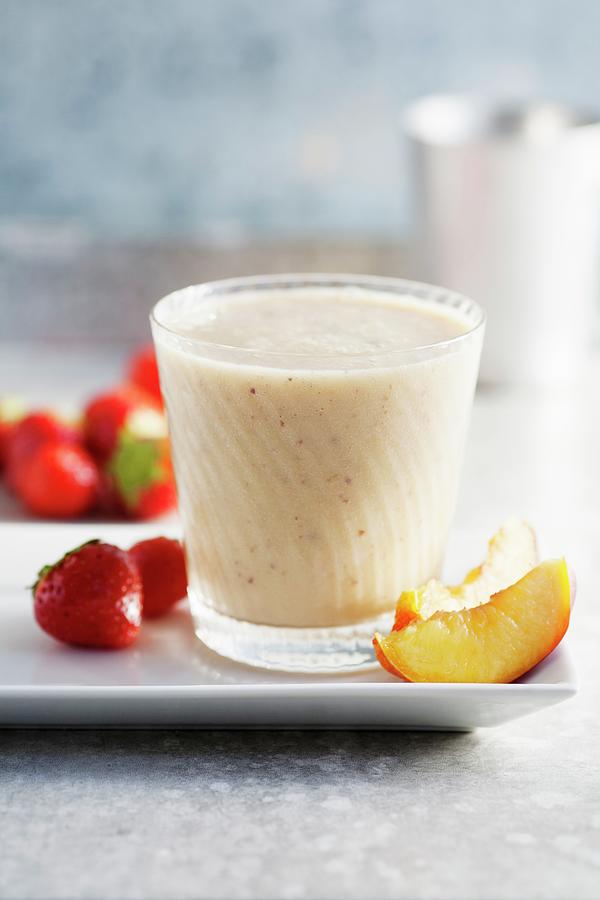 A Strawberry, Nectarine And Banana Smoothie Photograph by Victoria Firmston