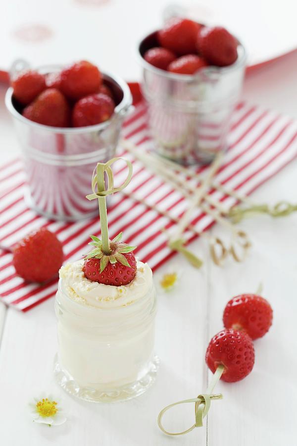 A Strawberry Skewer Dipped In A Jar Of Clotted Cream Photograph by Jane Saunders