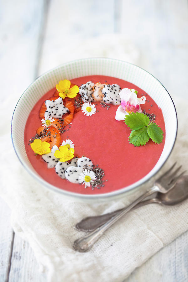 A Strawberry Smoothie Bowl With Banana, Oats, Dragon Fruit And Edible Flowers vegan Photograph by Jan Wischnewski