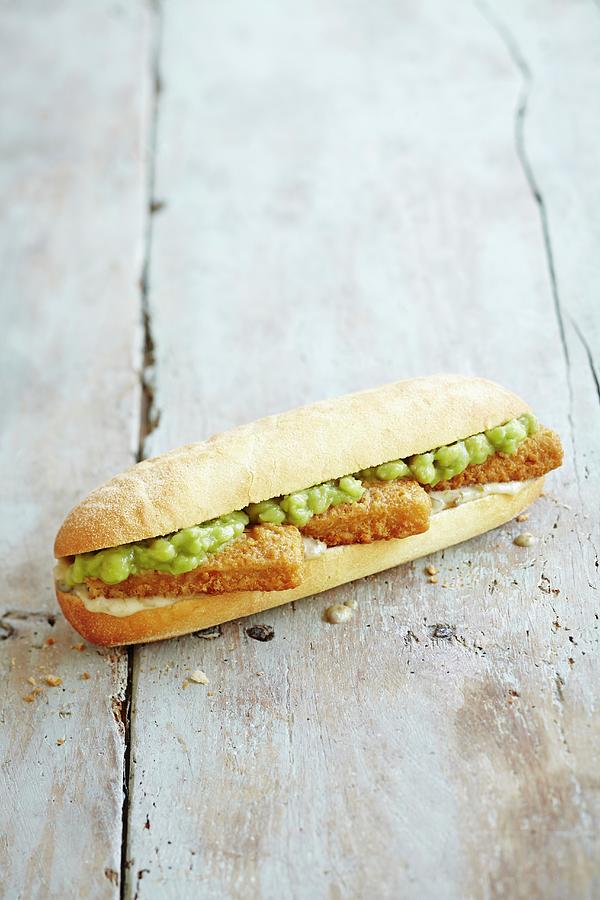 A Sub Sandwich With Fish Fingers, Tartare Sauce And Mushy Peas Photograph by Charlotte Tolhurst