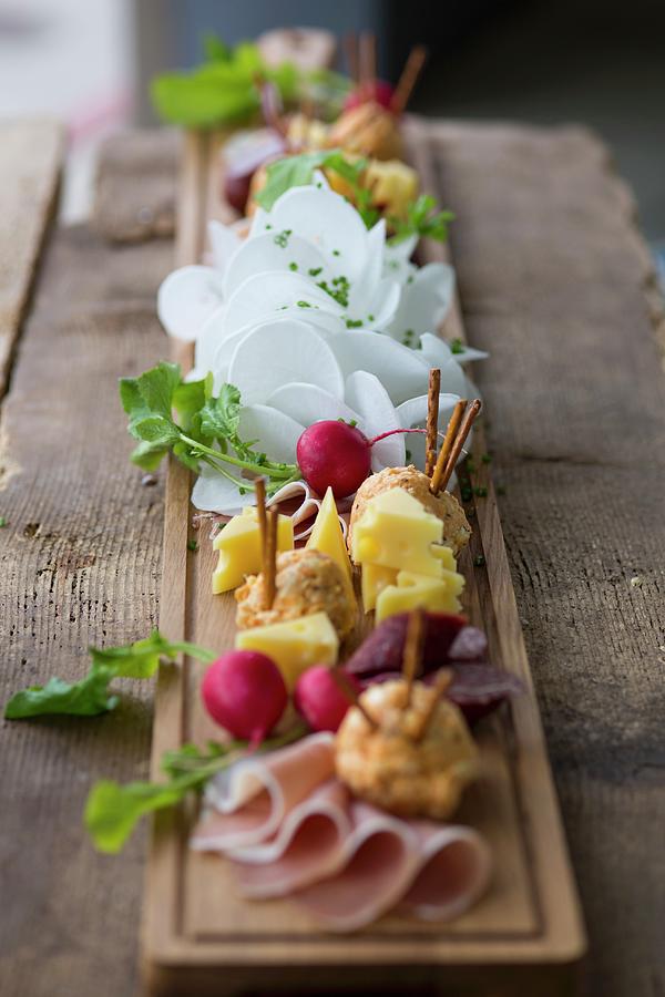 A Supper Board With Cheese, Obatzda bavarian Cheese Spread, Radishes And Ham At Oktober Fest Photograph by Eising Studio