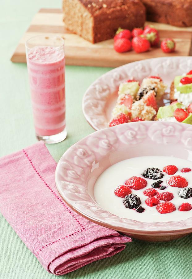 A Swedish Breakfast Of Berries In Sour Milk, Fruit And Coconut Skewers And Raspberry And Kiwi Smoothies Photograph by Hallstrm, Lars