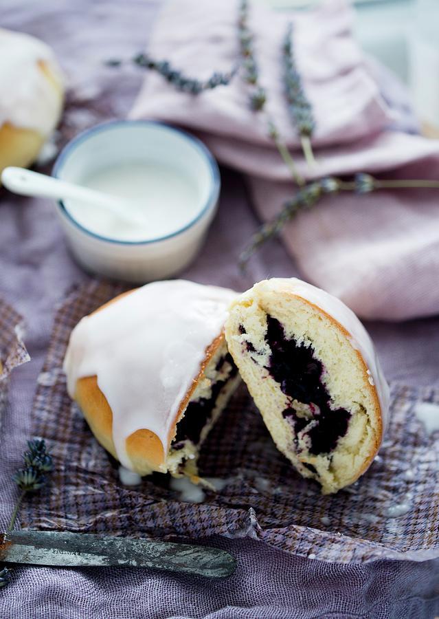 A Sweet Bun With A Berry Filling And Icing Photograph by Dorota Indycka