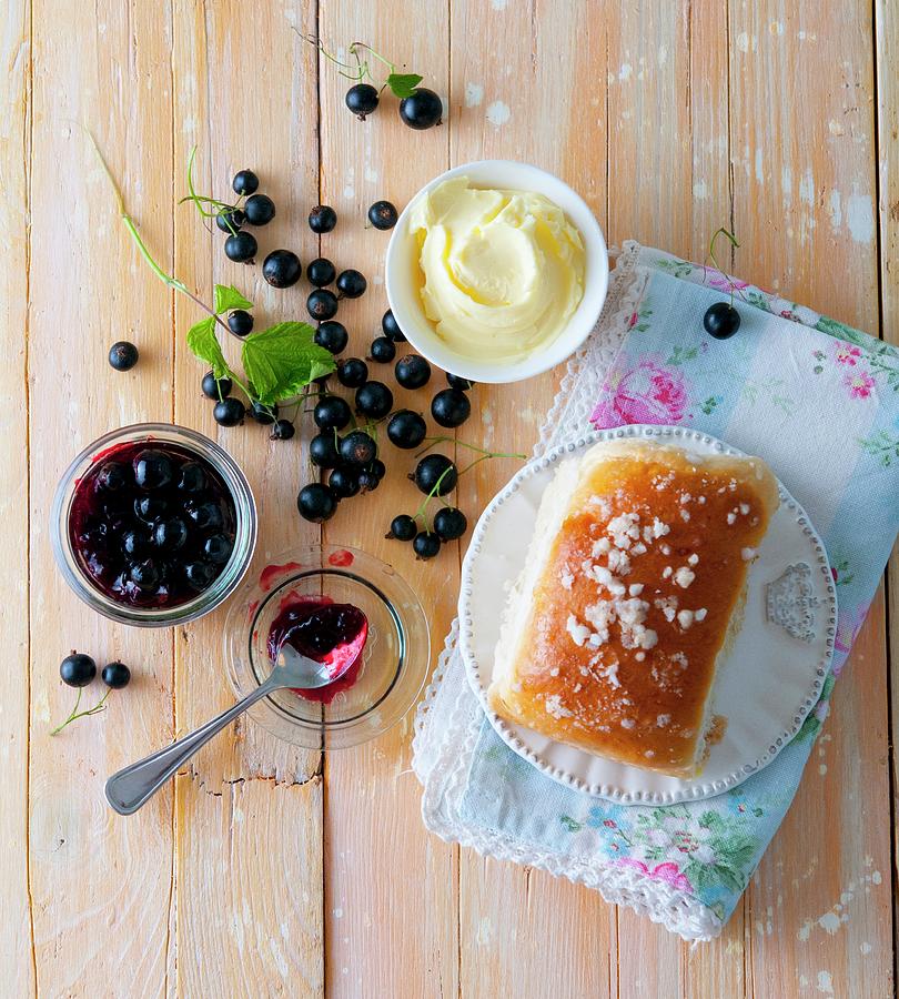 A Sweet Bun With Butter And Blackcurrant Jam Photograph by Udo Einenkel