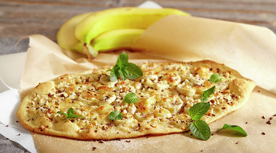 A Sweet Pizza With Banana, Chocolate Sprinkles And Mint From Brazil Photograph by Teubner Foodfoto