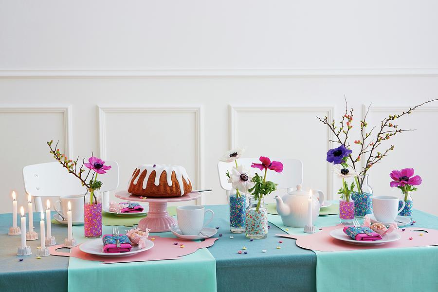 A Table Laid For A Birthday With Cake, Candles And Flowers In Decorative Vases Photograph by Jalag / Lisa Techt
