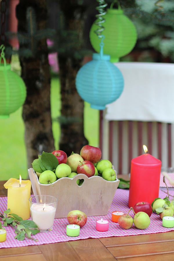 A Table Laid For A Garden Party With Fresh Apples And Candles Photograph by Sylvia E.k Photography