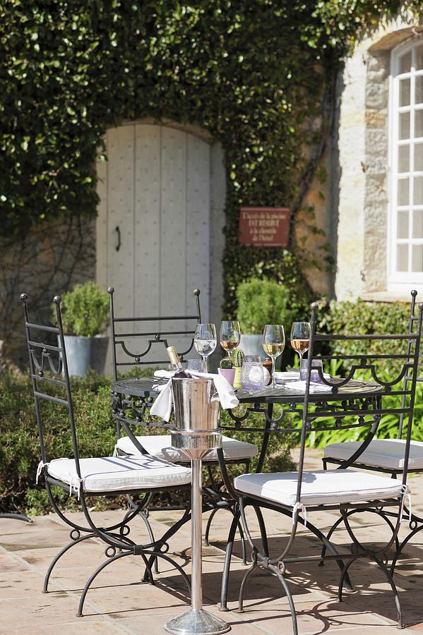 A Table Laid For A Meal In A Restaurant Garden Photograph by Anthony ...