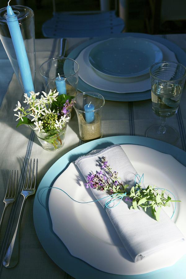 A Table Laid In Blue And White And Decorated With Flowers Photograph by Viola Cajo