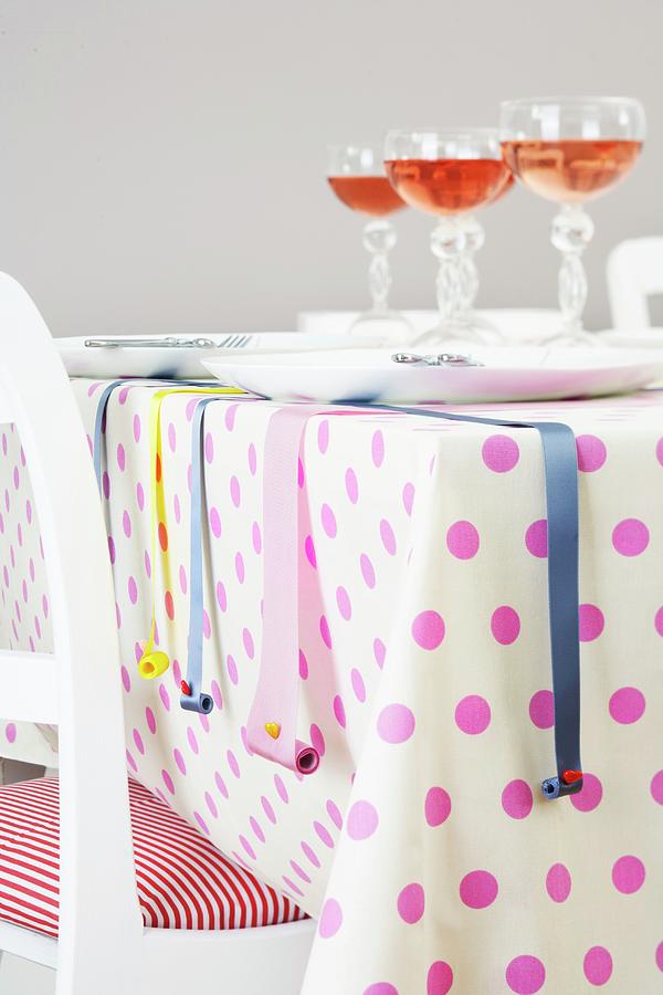 A Table Laid With A Spotted Tablecloth And Decorative Ribbons Photograph by Franziska Taube