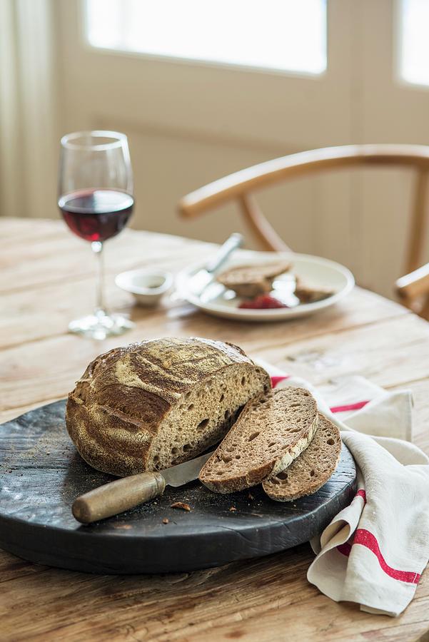 A Table Laid With Bread And Wine Photograph by Ashley Mackevicius