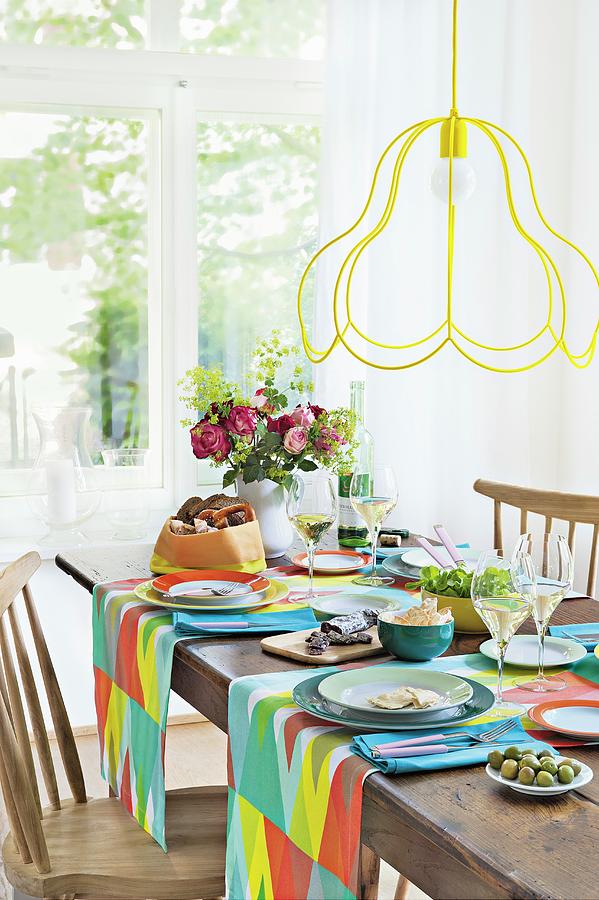 A Table Laid With Colourful Accessories, Sausage, Cheese And Bread Photograph by Jalag / Veronika Stark