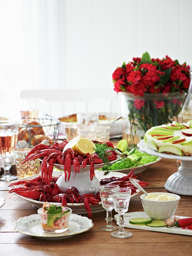 A Table Laid With Crayfish, Croissants, Apple Tart, Mayonnaise, And Horseradish Schnapps sweden Photograph by Hannah Kompanik
