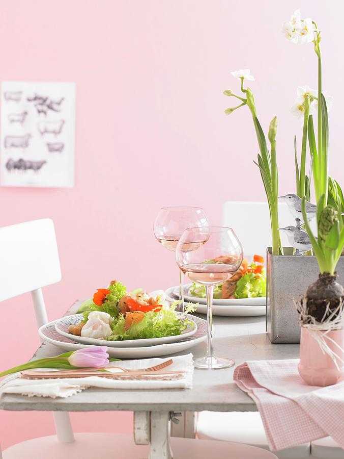 A Table Laid With Salad, Wine And Spring Flowers For Easter Photograph by Jan-peter Westermann