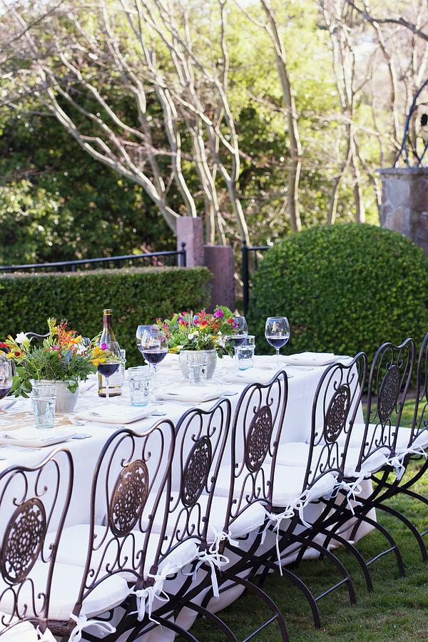 A Table Set For Dining Outdoors Photograph by Jennifer Martine