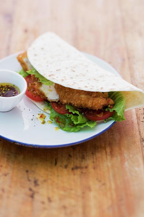Chicken Photograph - A Taco Filled With Breaded Chicken Served With A Chilli Dip by Michael Wissing