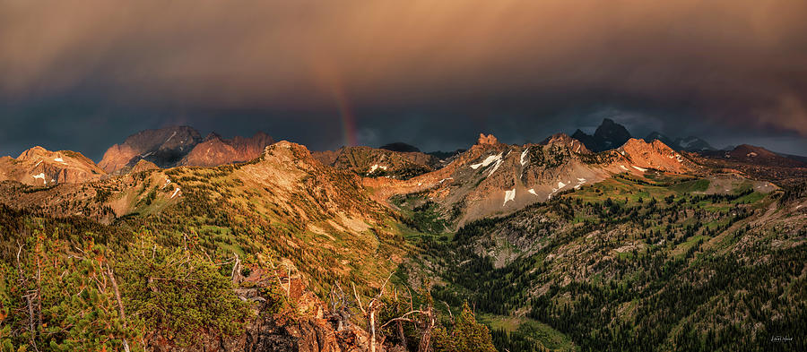 A thunder shower and rainbow in the Tetons Photograph by Leland D Howard